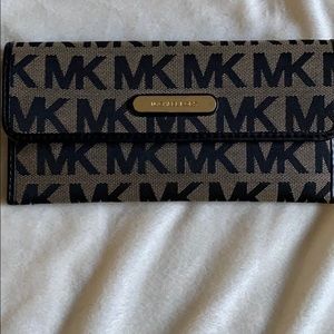 MK wallet monograph